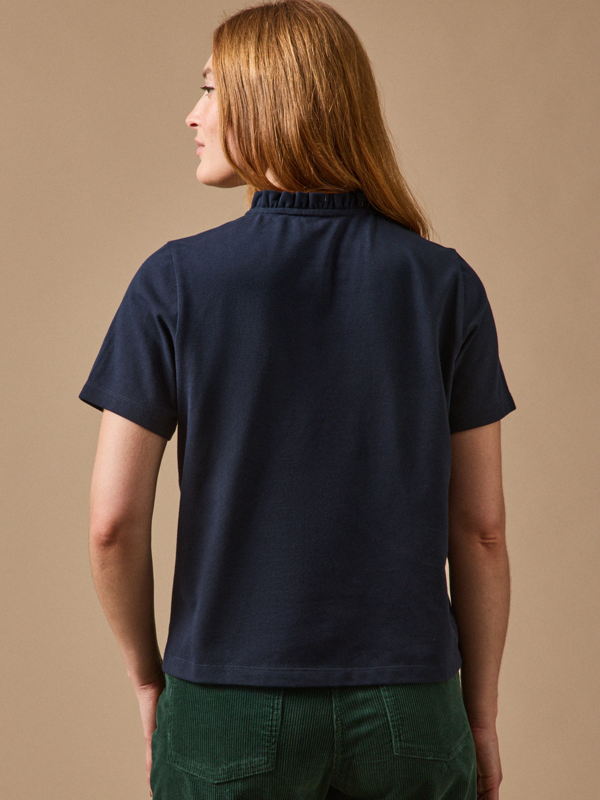 Polo maille piquée col volanté femme