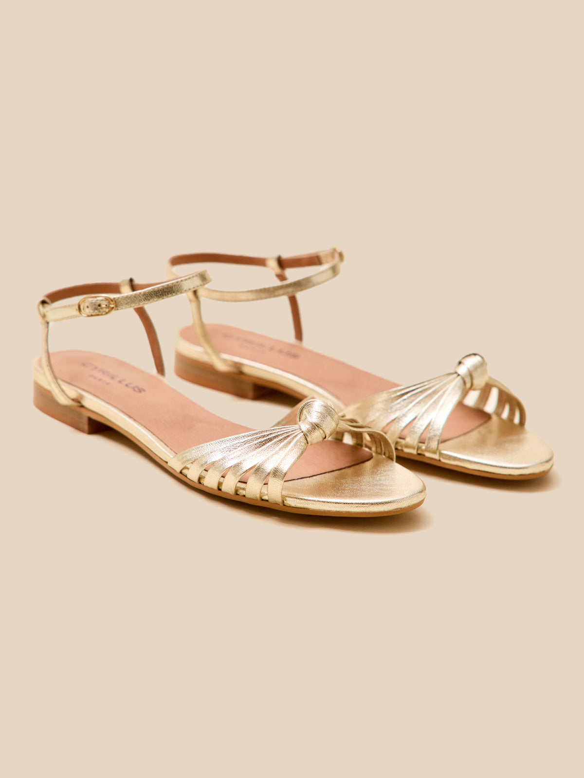 Women's flat metallic leather sandals