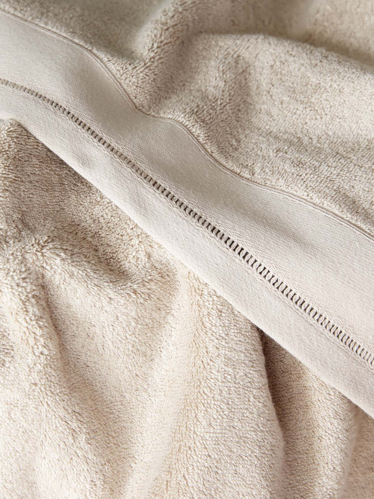 Terry cloth towel with ladderline stitching
