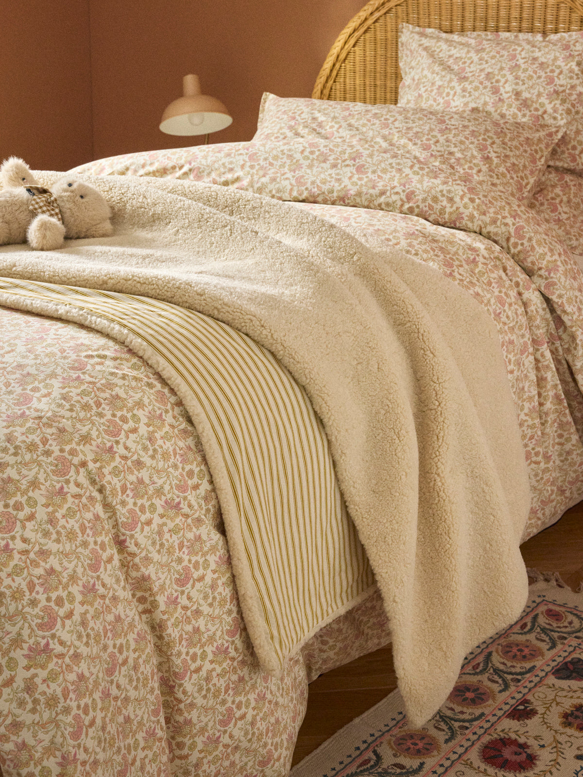 Reversible sherpa and striped blanket throw