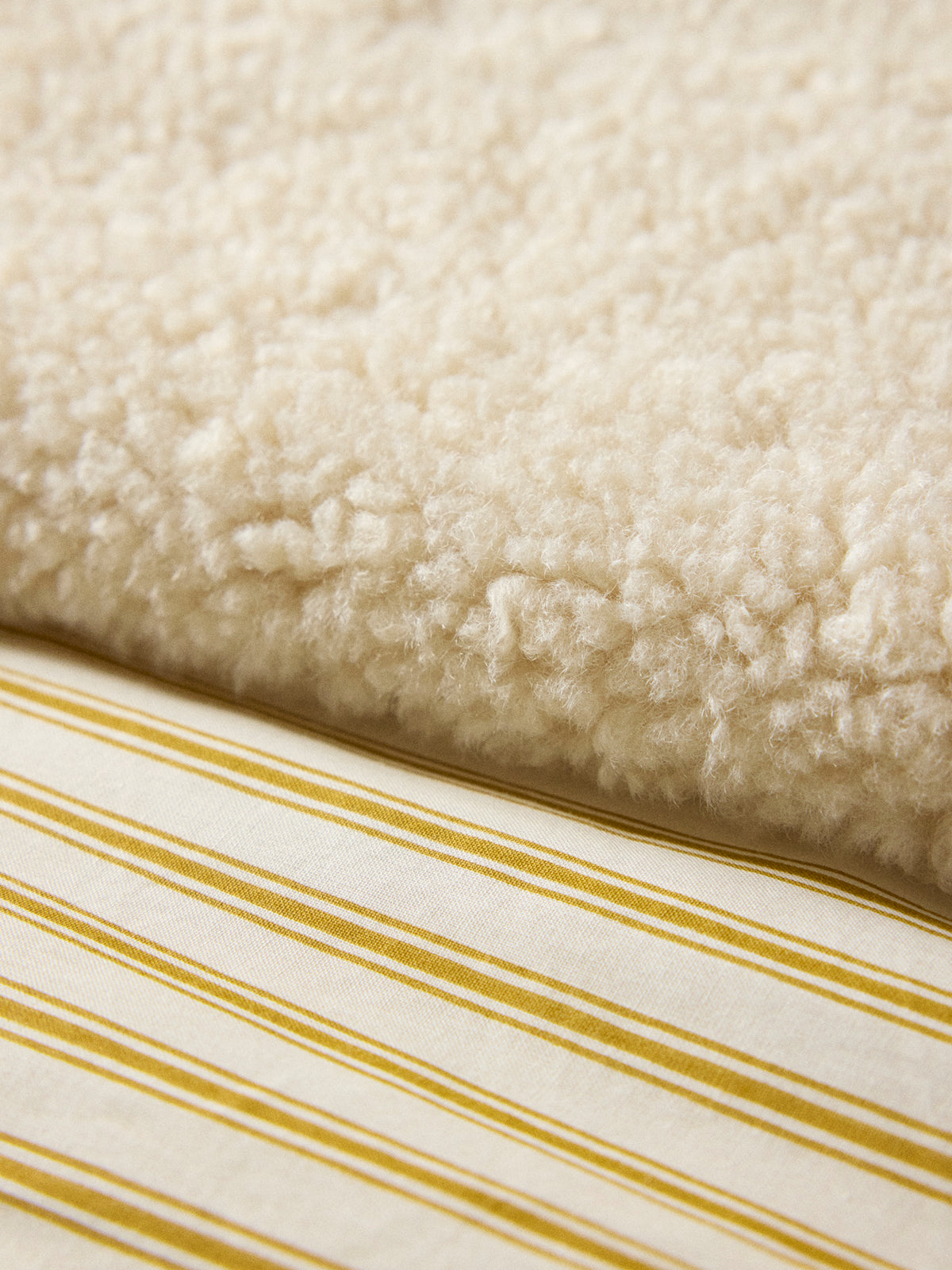 Reversible sherpa and striped blanket throw