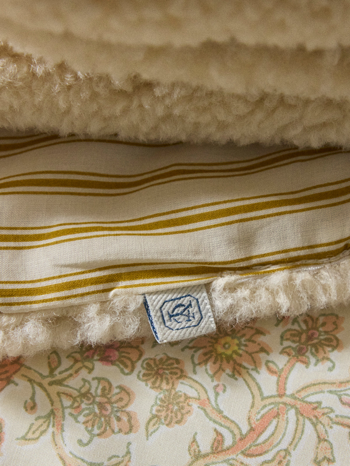 Reversible sherpa and striped blanket throw