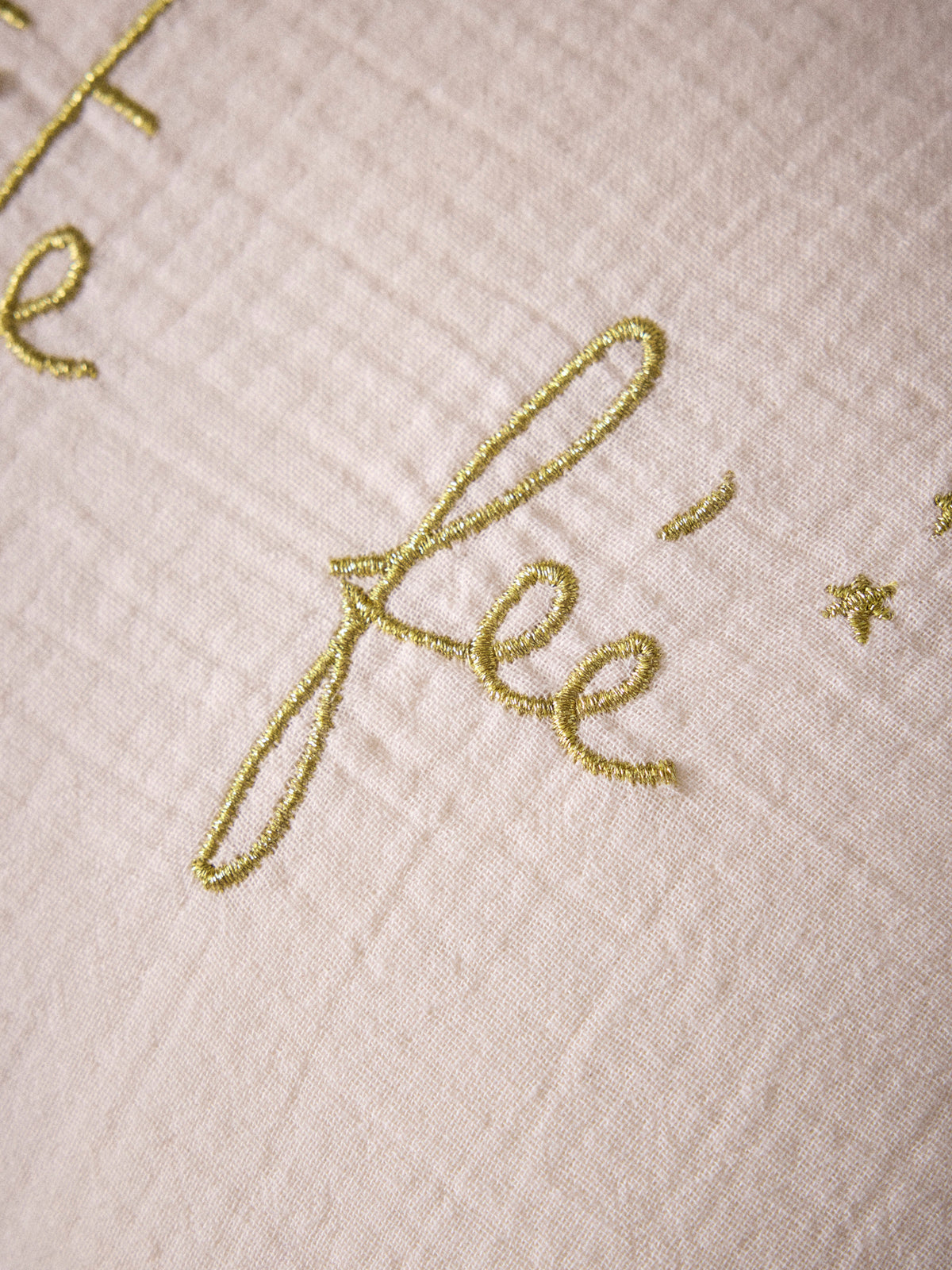 Ruffled gauze pillow with gold embroidery