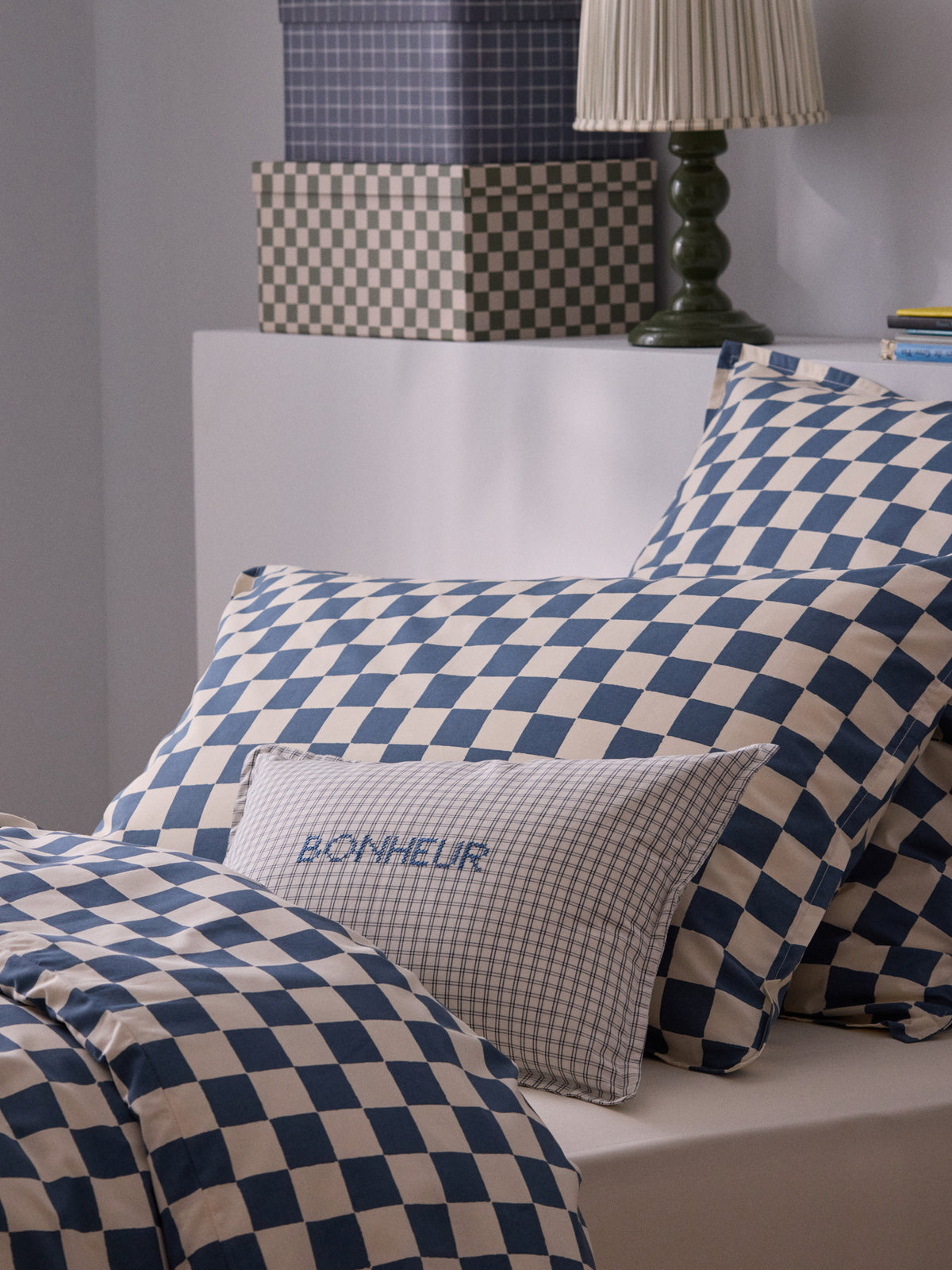 Cushion cover with little embroidered checks