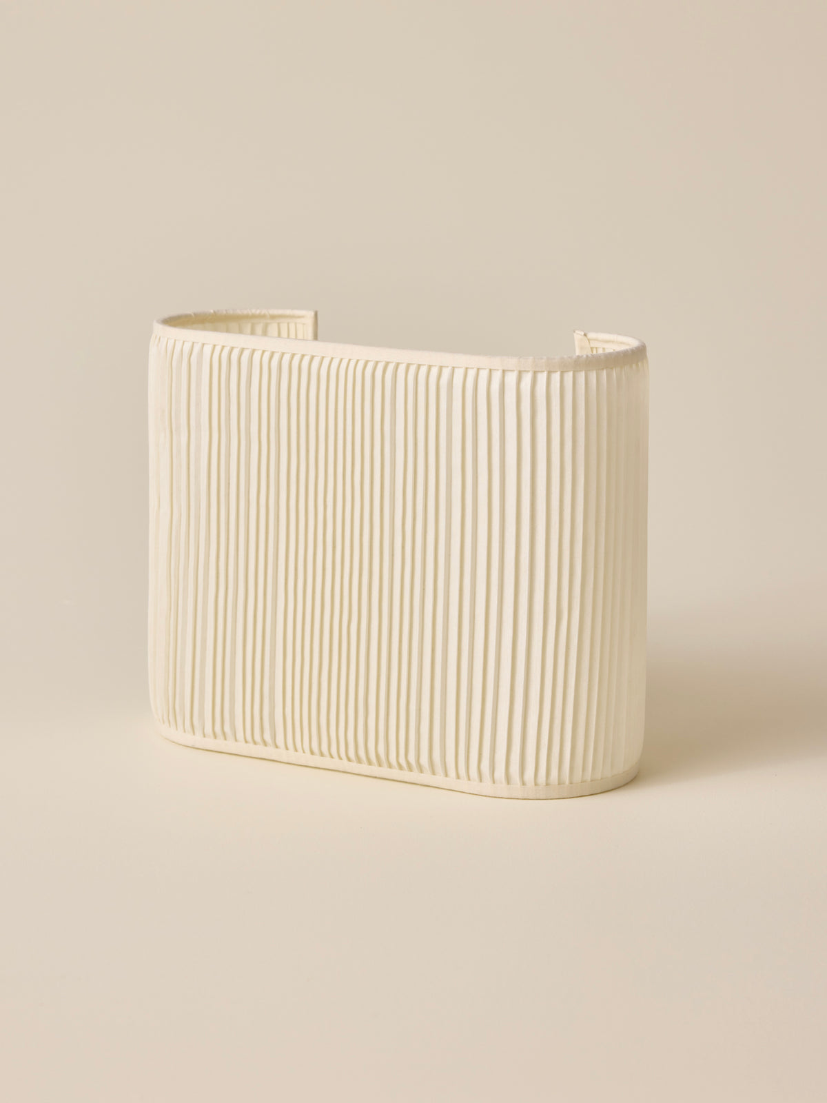 Oval pleated wall lamp