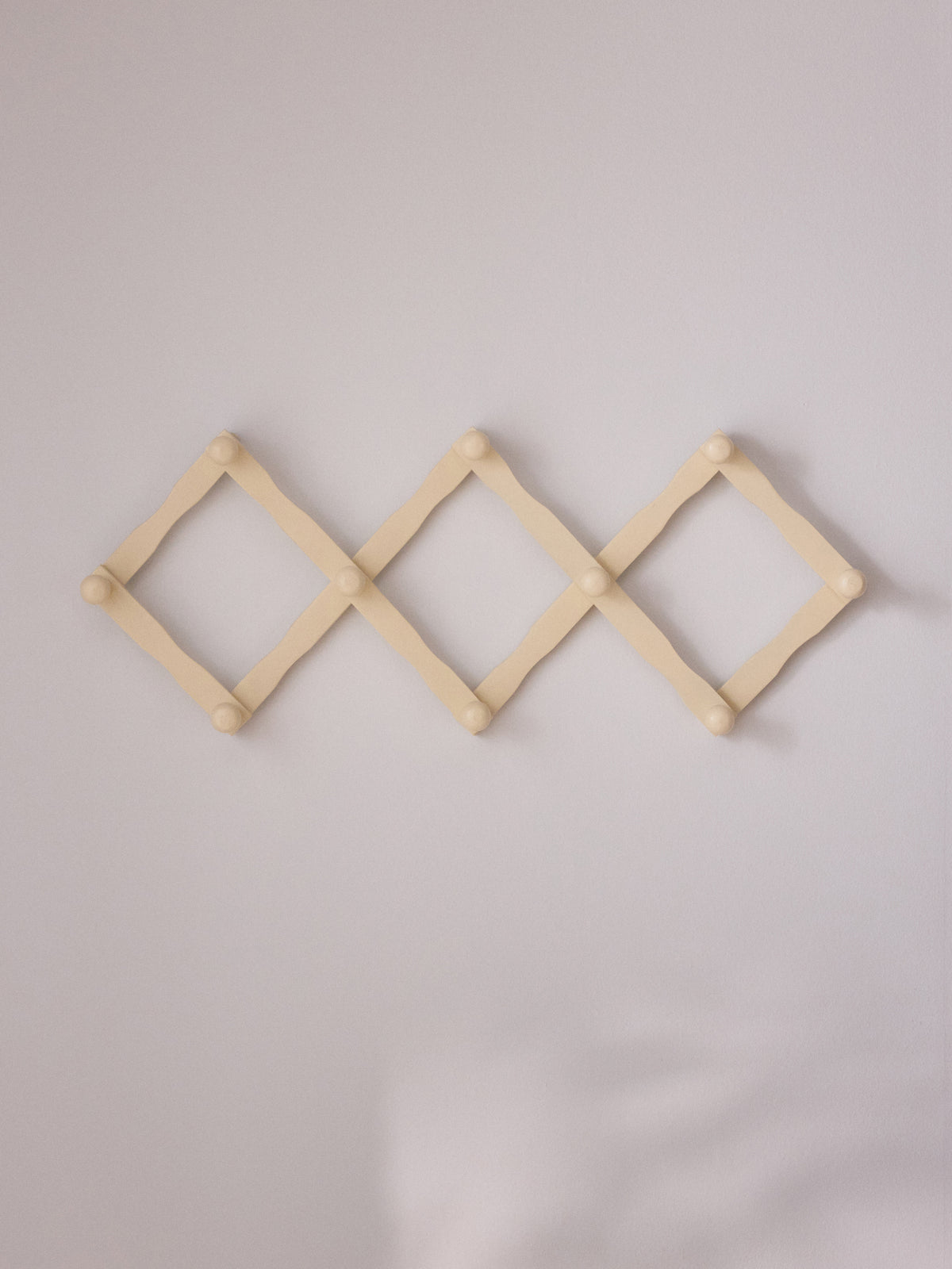 Wooden accordion coat hook