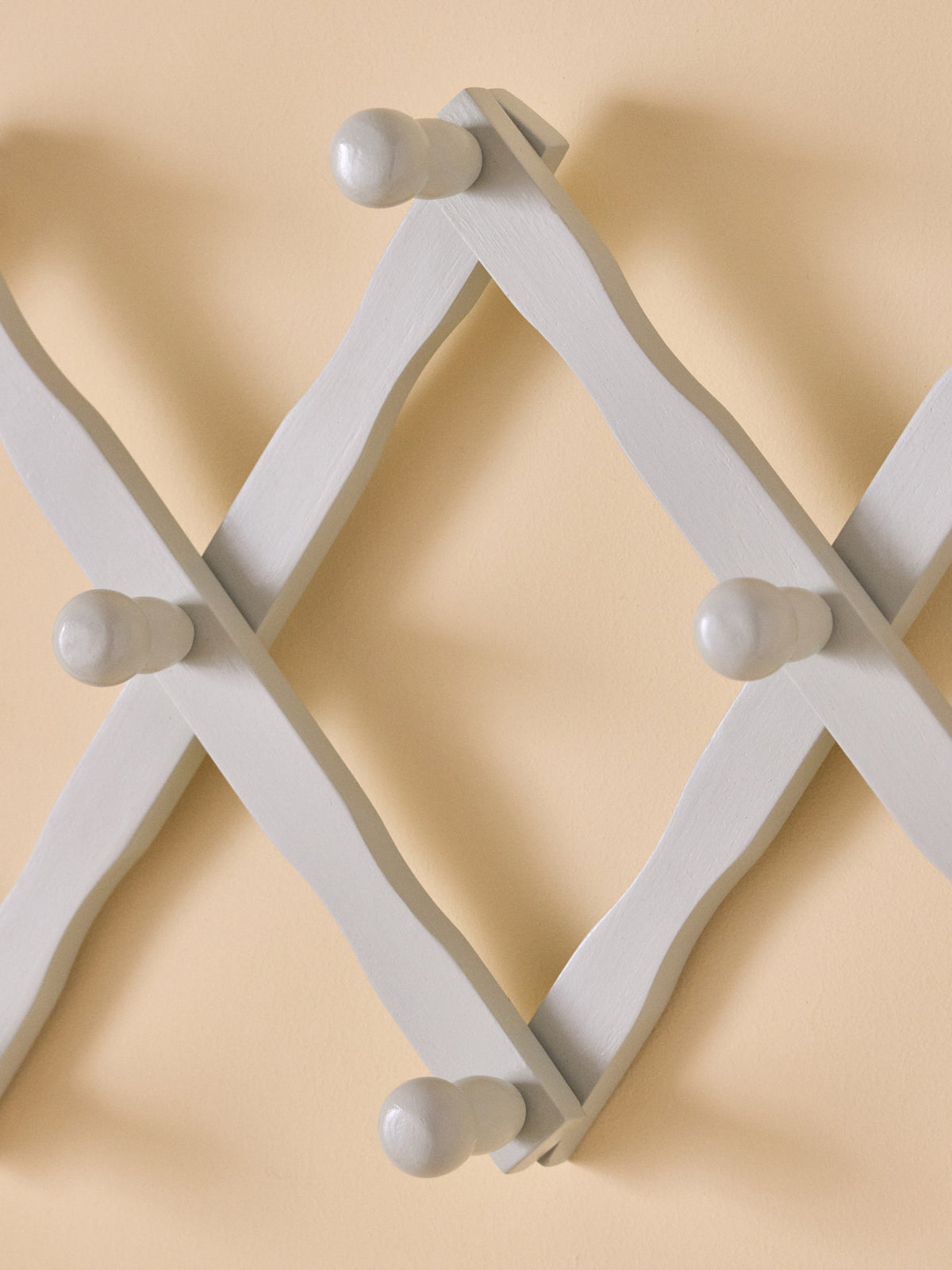 Wooden accordion coat hook
