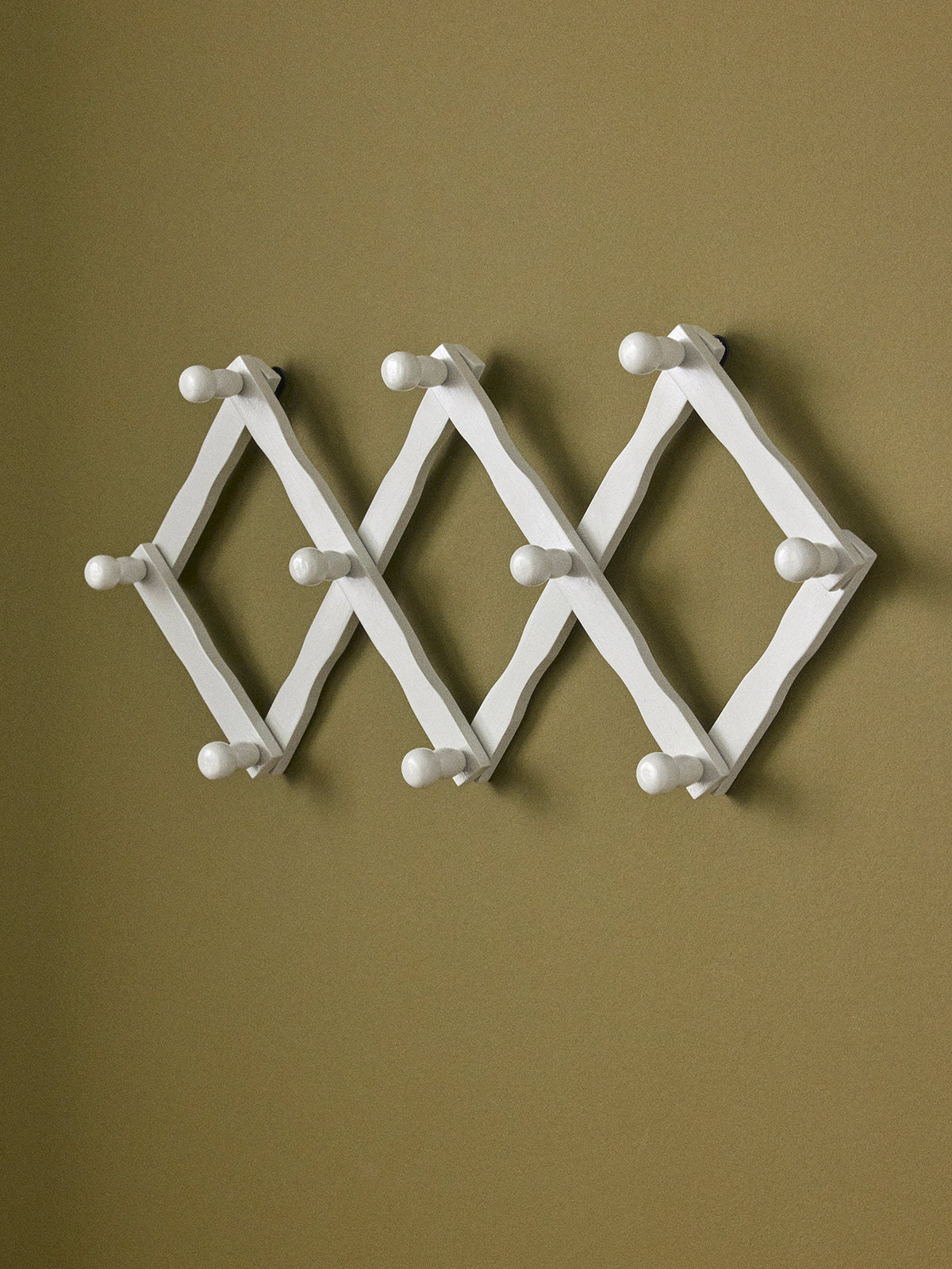 Wooden accordion coat hook