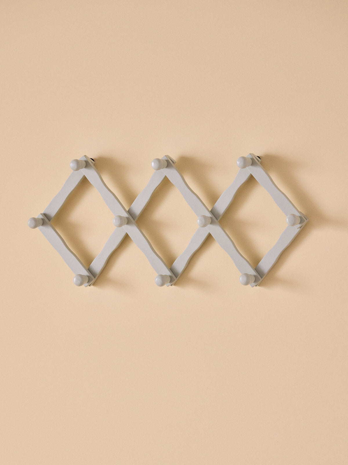 Wooden accordion coat hook