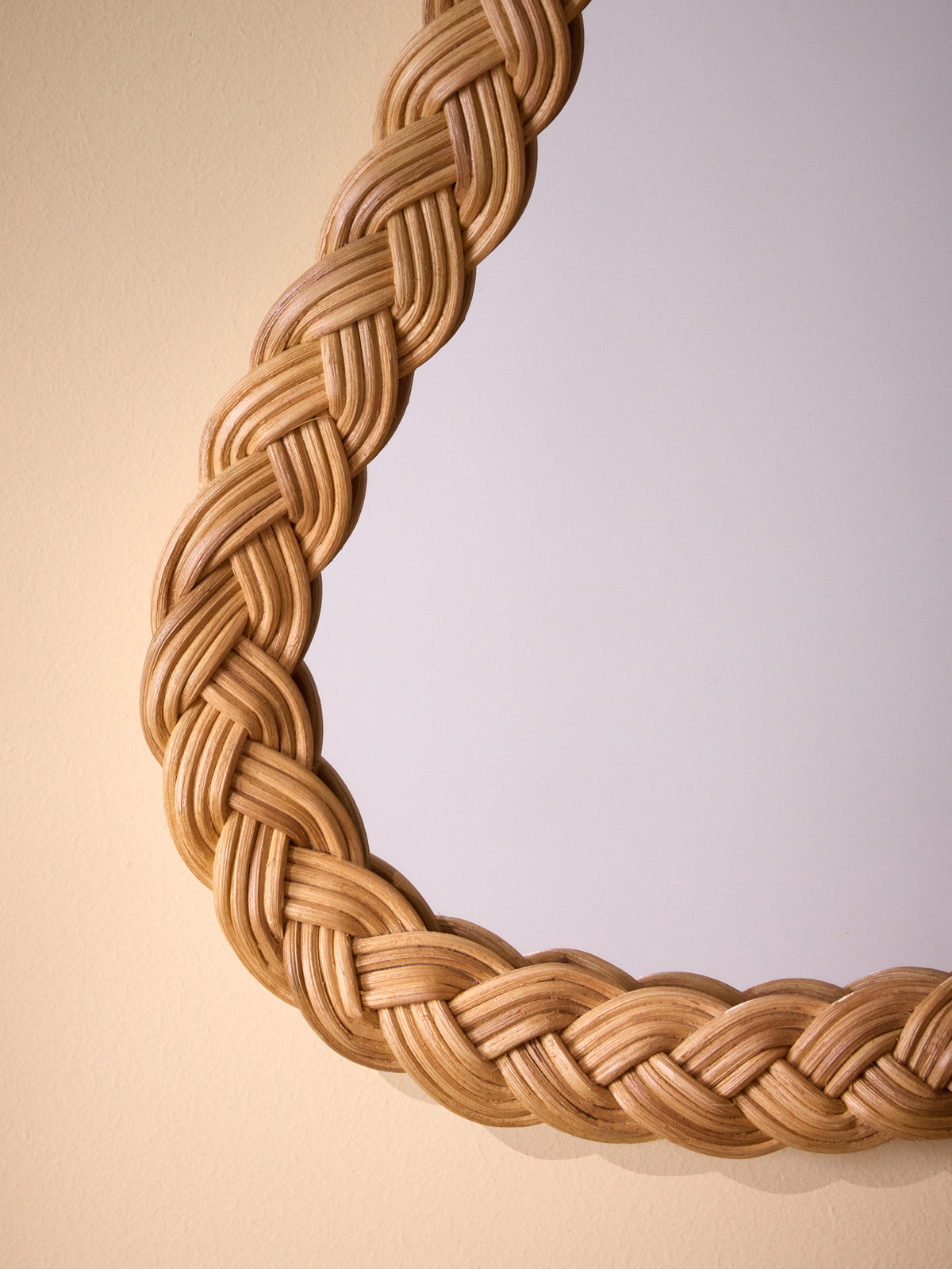Pear-shaped wicker wall mirror