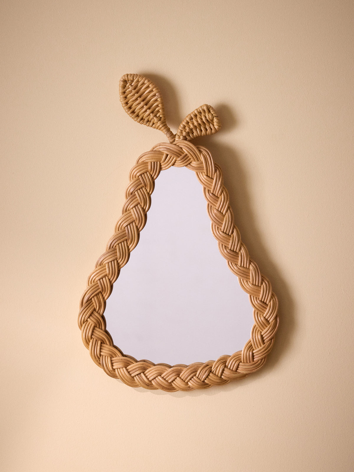 Pear-shaped wicker wall mirror