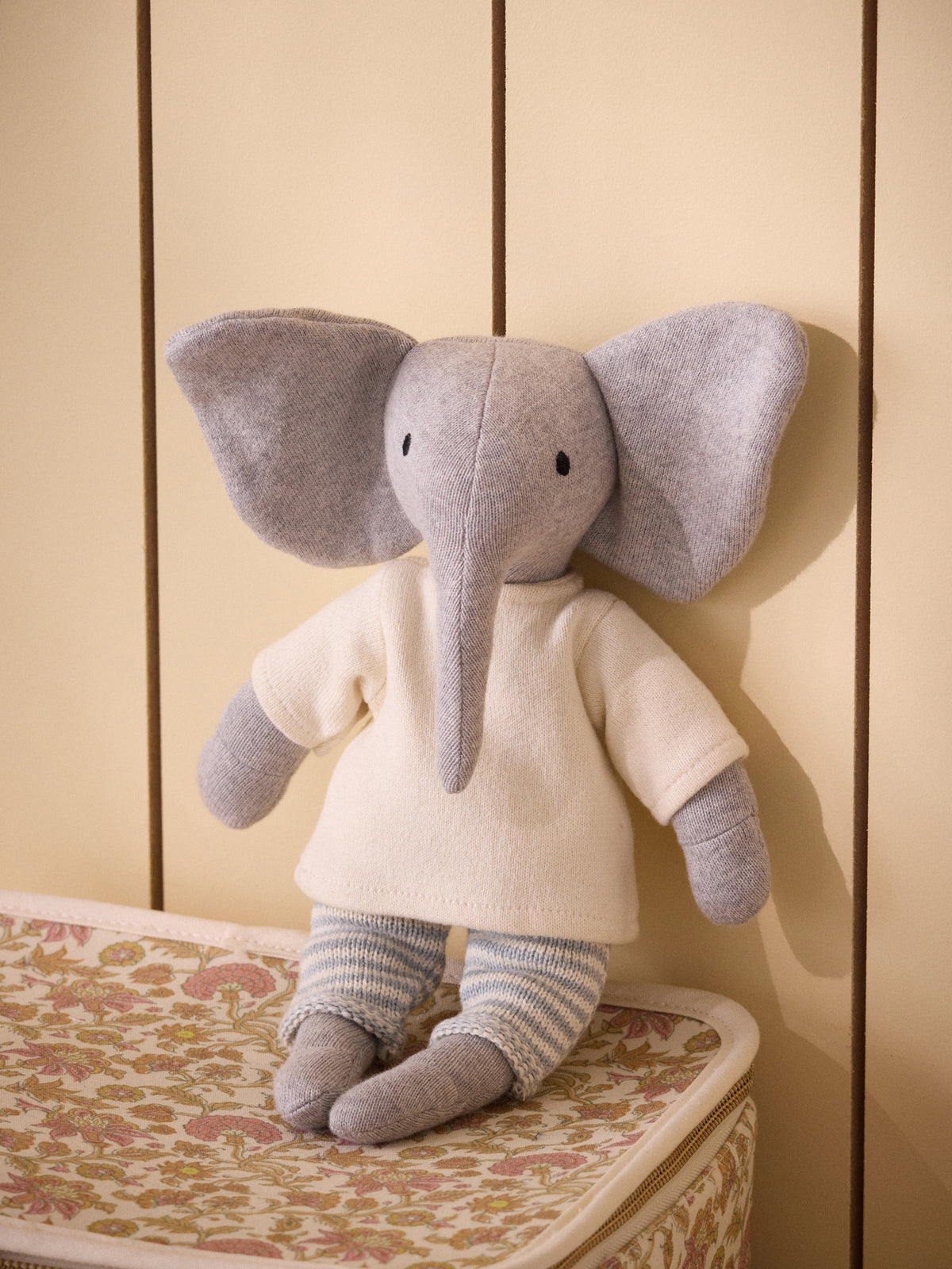 Knit elephant plush toy in a garter-stitch outfit