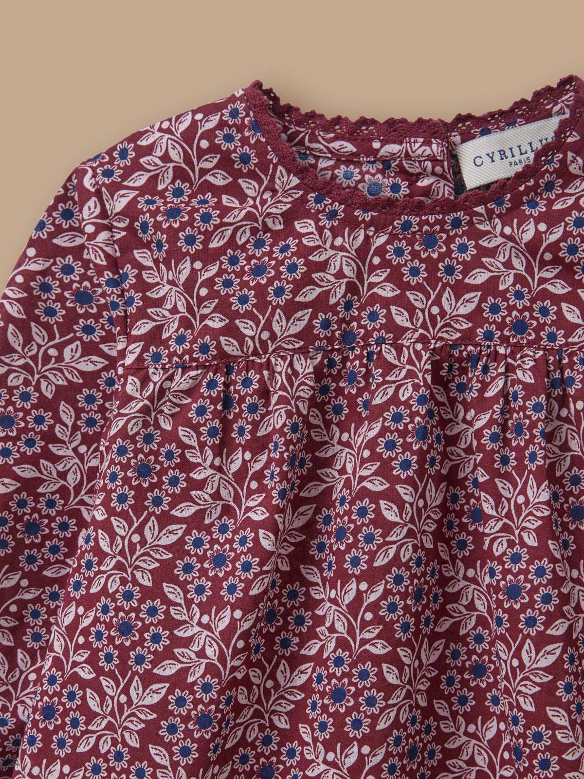 Baby blouse with lace collar and printed pattern