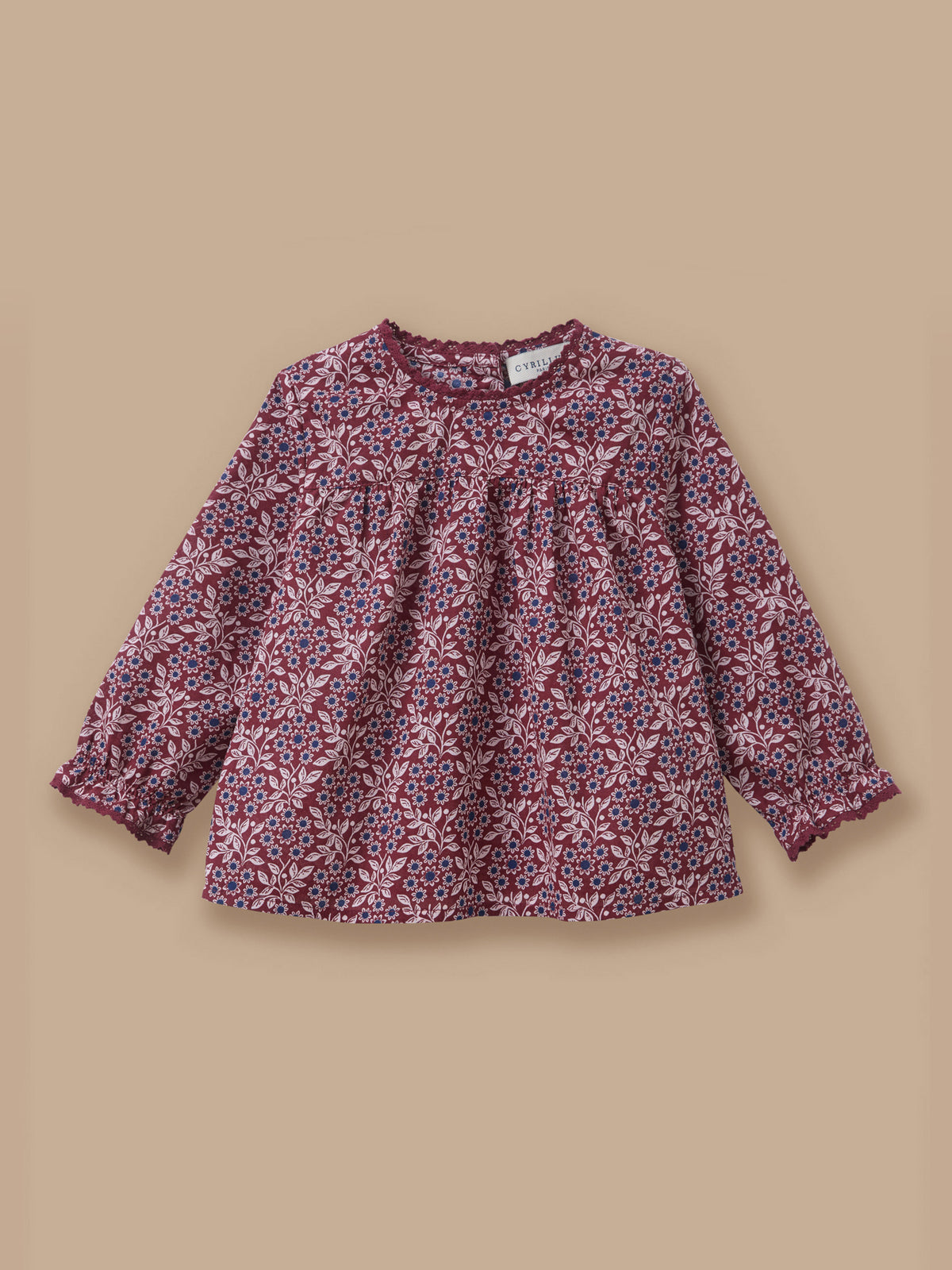 Baby blouse with lace collar and printed pattern