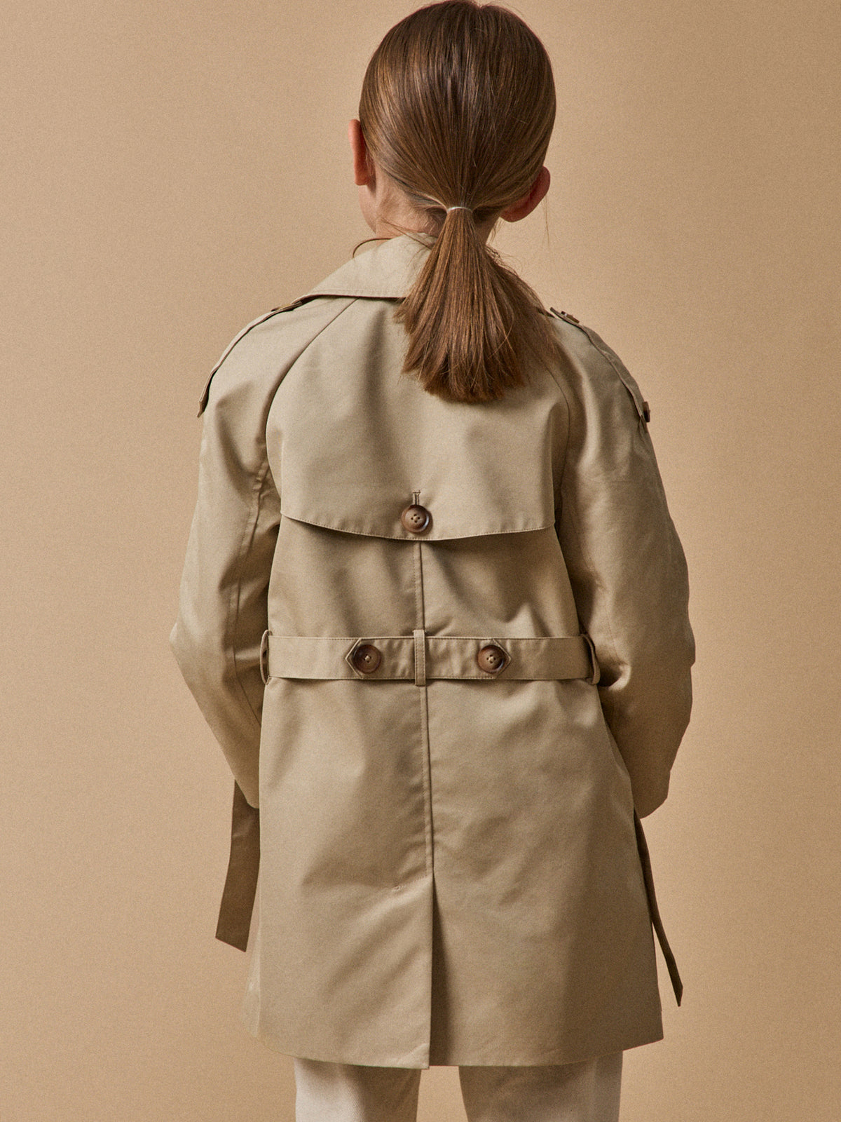 Girl's iconic trench coat