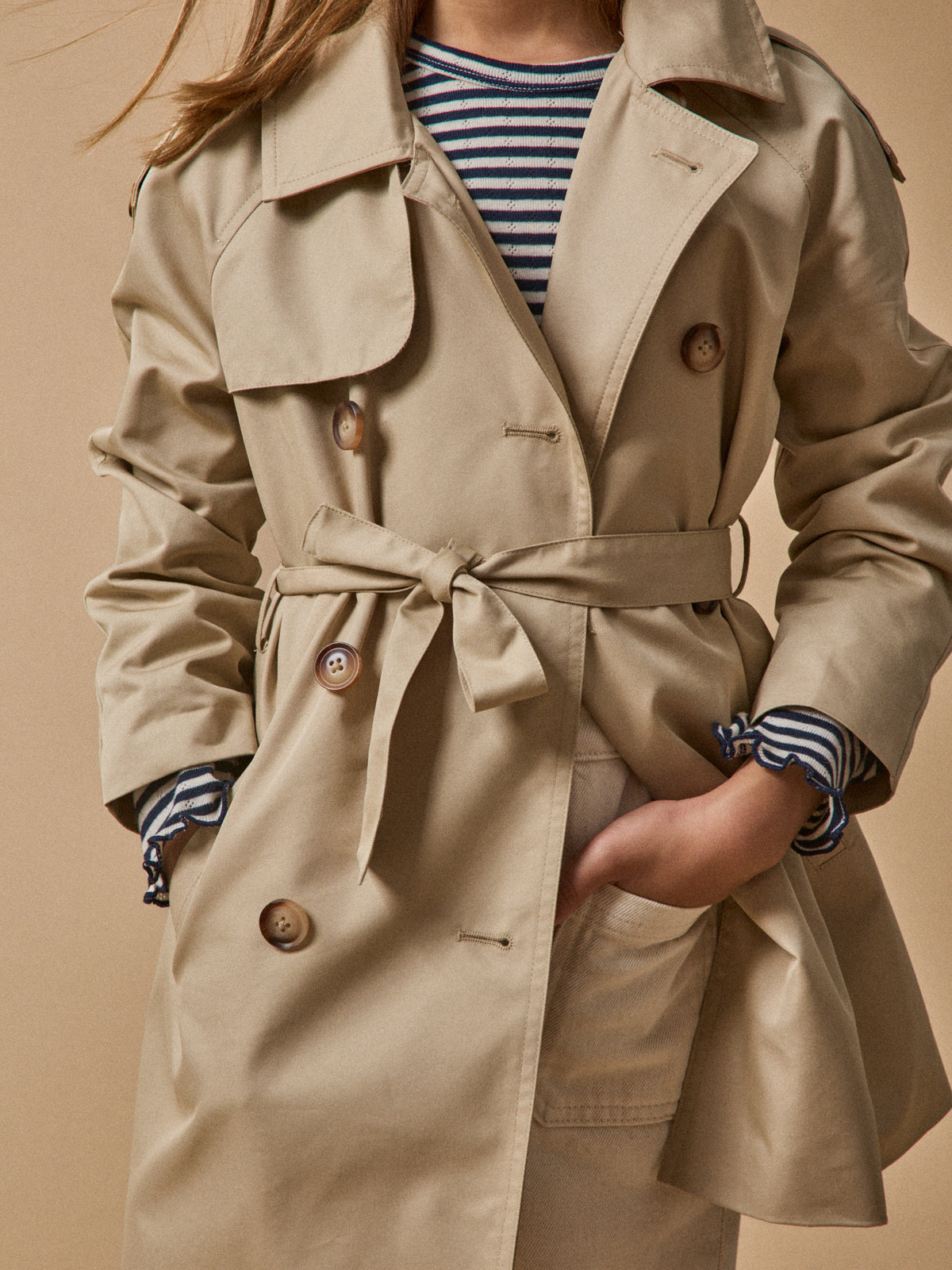 Girl's iconic trench coat
