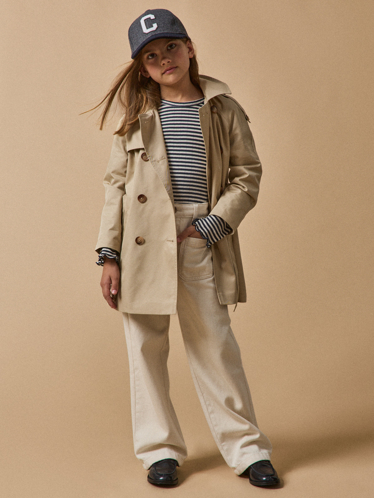 Girl's iconic trench coat